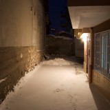 Snowy night alley